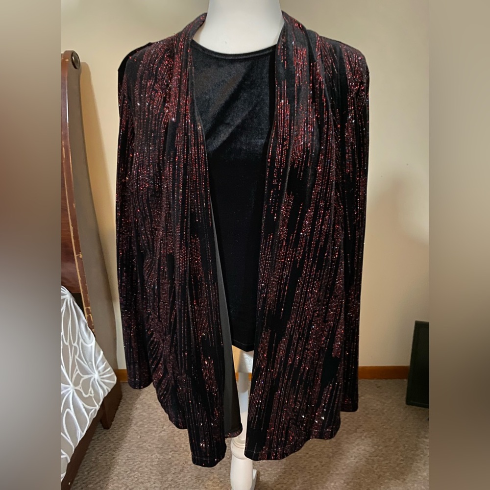 Shimmering dress top with attached camisole. Very pretty and glamorous.